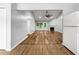 Open-concept living room with hardwood floors, vaulted ceiling, and a cozy fireplace at 3019 Camden Way, Alpharetta, GA 30005