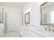 Bathroom features double sinks, a granite countertop, framed mirrors, and walk-in shower at 5623 Meadowstone Walk, Kennesaw, GA 30152