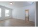 Spacious bedroom with wood floors and natural light from the windows at 5623 Meadowstone Walk, Kennesaw, GA 30152