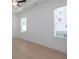 Bedroom boasts natural light, a ceiling fan, and neutral paint scheme at 5623 Meadowstone Walk, Kennesaw, GA 30152