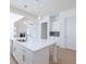 The kitchen features a kitchen island with stainless steel sink and modern pendant lighting at 5623 Meadowstone Walk, Kennesaw, GA 30152