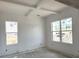 Bright living room featuring white walls and trim, complemented by windows and natural light at 5623 Meadowstone Walk, Kennesaw, GA 30152