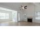 Bright living room features a fireplace, cathedral ceilings, and large windows at 5623 Meadowstone Walk, Kennesaw, GA 30152