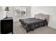 Bedroom showcases ample natural light, a cozy bed and dark wooden furnishings with cozy carpet at 707 Ralph Still Rd, Dacula, GA 30019