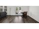Cozy dining area features dark wood floors and natural light streaming in from the patio doors at 707 Ralph Still Rd, Dacula, GA 30019