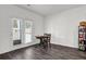 Sunlit dining nook featuring a charming table set and a patio door that leads to the yard at 707 Ralph Still Rd, Dacula, GA 30019