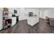 Modern kitchen with white cabinetry, stainless steel appliances, a center island, and dark wood flooring at 707 Ralph Still Rd, Dacula, GA 30019