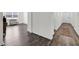 View of the living room with hardwood floors and natural light from the windows at 707 Ralph Still Rd, Dacula, GA 30019