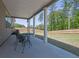 Covered patio with furniture overlooking a spacious backyard and lush trees at 707 Ralph Still Rd, Dacula, GA 30019