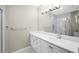 Clean bathroom with a white vanity, a large mirror, and a glass-enclosed shower at 211 Colonial Homes Nw Dr # 1105, Atlanta, GA 30309