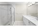 Bright bathroom features a glass-enclosed shower, white tile, and updated fixtures at 211 Colonial Homes Nw Dr # 1105, Atlanta, GA 30309