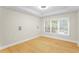 Well-lit bedroom with natural light, wooden floors, and a bright airy feel at 211 Colonial Homes Nw Dr # 1105, Atlanta, GA 30309