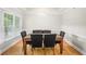 Bright dining room with natural light, wooden floors, and modern light fixtures at 211 Colonial Homes Nw Dr # 1105, Atlanta, GA 30309