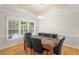 Window-lit dining room with natural light, wooden floors, and modern light fixtures at 211 Colonial Homes Nw Dr # 1105, Atlanta, GA 30309