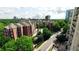 Beautiful brick apartment complex surrounded by lush greenery and mature trees at 211 Colonial Homes Nw Dr # 1105, Atlanta, GA 30309