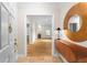 Inviting foyer featuring hardwood floors and a view into the living room with a fireplace at 211 Colonial Homes Nw Dr # 1105, Atlanta, GA 30309