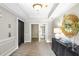 A luxurious hallway with elegant decor, including a decorative mirror and stylish furniture at 211 Colonial Homes Nw Dr # 1105, Atlanta, GA 30309