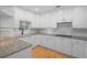 Modern kitchen with white cabinetry, granite countertops, and stainless steel appliances at 211 Colonial Homes Nw Dr # 1105, Atlanta, GA 30309