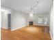 Bright living room featuring hardwood floors, a fireplace, and access to the outdoor balcony at 211 Colonial Homes Nw Dr # 1105, Atlanta, GA 30309