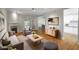 Bright living room with hardwood floors, a fireplace, and access to the kitchen and dining area at 211 Colonial Homes Nw Dr # 1105, Atlanta, GA 30309