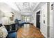 Inviting lobby with herringbone floors, elegant lighting, elevator, and stylish decor at 211 Colonial Homes Nw Dr # 1105, Atlanta, GA 30309
