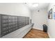 Mailboxes in a condo hallway with wood floors at 211 Colonial Homes Nw Dr # 1105, Atlanta, GA 30309