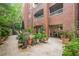 Extensive patio with brick facade, garden space, and outdoor seating, ideal for entertaining guests at 211 Colonial Homes Nw Dr # 1105, Atlanta, GA 30309