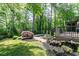 Backyard featuring mature trees, a small pool and a mulched garden space at 610 Valley Green Trce, Marietta, GA 30068