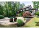 Gorgeous backyard with a pool, jacuzzi, lush landscaping, and plenty of room for entertaining at 610 Valley Green Trce, Marietta, GA 30068