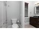 Bathroom featuring a toilet, shower with curtain, and vanity with granite countertop at 610 Valley Green Trce, Marietta, GA 30068