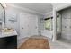 Bright bathroom with soaking tub, stand-up shower, and double doors to linen closet at 610 Valley Green Trce, Marietta, GA 30068
