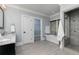 Elegant bathroom with a standalone tub, walk-in shower, and double vanity sinks at 610 Valley Green Trce, Marietta, GA 30068