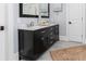 Bathroom features a double sink vanity with marble countertop and modern fixtures at 610 Valley Green Trce, Marietta, GA 30068