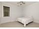 Bright bedroom features a ceiling fan, neutral decor, and large window at 610 Valley Green Trce, Marietta, GA 30068