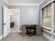 Bedroom with a desk, chair, and view to the bathroom with a vanity and bright light at 610 Valley Green Trce, Marietta, GA 30068