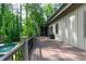 Expansive deck overlooking the fenced pool area with lush backyard landscaping at 610 Valley Green Trce, Marietta, GA 30068