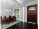 Dining room featuring dark wood floors and furnishings and a decorative chandelier at 610 Valley Green Trce, Marietta, GA 30068