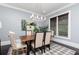 Bright dining room showcasing a modern chandelier, natural light, and stylish decor at 610 Valley Green Trce, Marietta, GA 30068