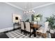 Dining area with a modern light fixture, artwork, and view of the open-concept living space at 610 Valley Green Trce, Marietta, GA 30068