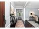Elegant entryway with dark wood floors, console table, and view into the bright, open living spaces at 610 Valley Green Trce, Marietta, GA 30068