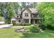 Charming two-story brick home featuring a well-manicured lawn and inviting front porch, perfect for relaxation at 610 Valley Green Trce, Marietta, GA 30068