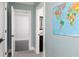 View down hallway with an open door and map on the wall at 610 Valley Green Trce, Marietta, GA 30068