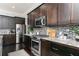Updated kitchen with stainless steel appliances and dark hardwood floors at 610 Valley Green Trce, Marietta, GA 30068