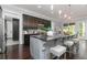 Gourmet kitchen boasts a large island, dark wood cabinets, and stainless appliances at 610 Valley Green Trce, Marietta, GA 30068