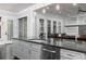 Kitchen island with dark granite countertops, stainless steel appliances and pendant lighting at 610 Valley Green Trce, Marietta, GA 30068