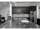 Kitchen features an island with seating, stainless appliances and dark cabinets, and a stainless refrigerator at 610 Valley Green Trce, Marietta, GA 30068