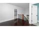 Second floor landing with hardwood floors, stairway and views to adjacent rooms at 610 Valley Green Trce, Marietta, GA 30068