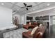 The living room features a modern kitchen, a staircase, and a large leather sofa for comfortable living at 610 Valley Green Trce, Marietta, GA 30068