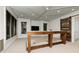 Spacious living area features coffered ceilings, recessed lighting, and a rustic sliding barn door at 610 Valley Green Trce, Marietta, GA 30068