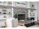 Close-up of a living room showcasing a stone fireplace and built-in shelves at 610 Valley Green Trce, Marietta, GA 30068